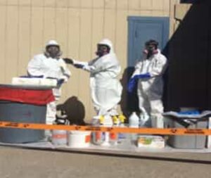 Group of people wearinf biohazard suitrs.2109211251254