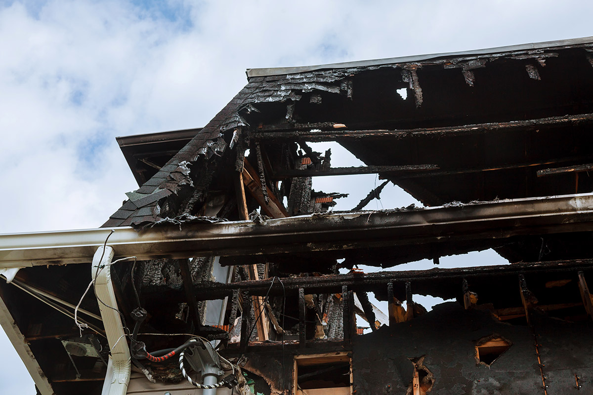 Burnt interiors of house after fire. Burned wooden walls the house after the fire