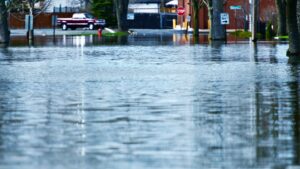 A town’s roadway flooded with over a foot of water.