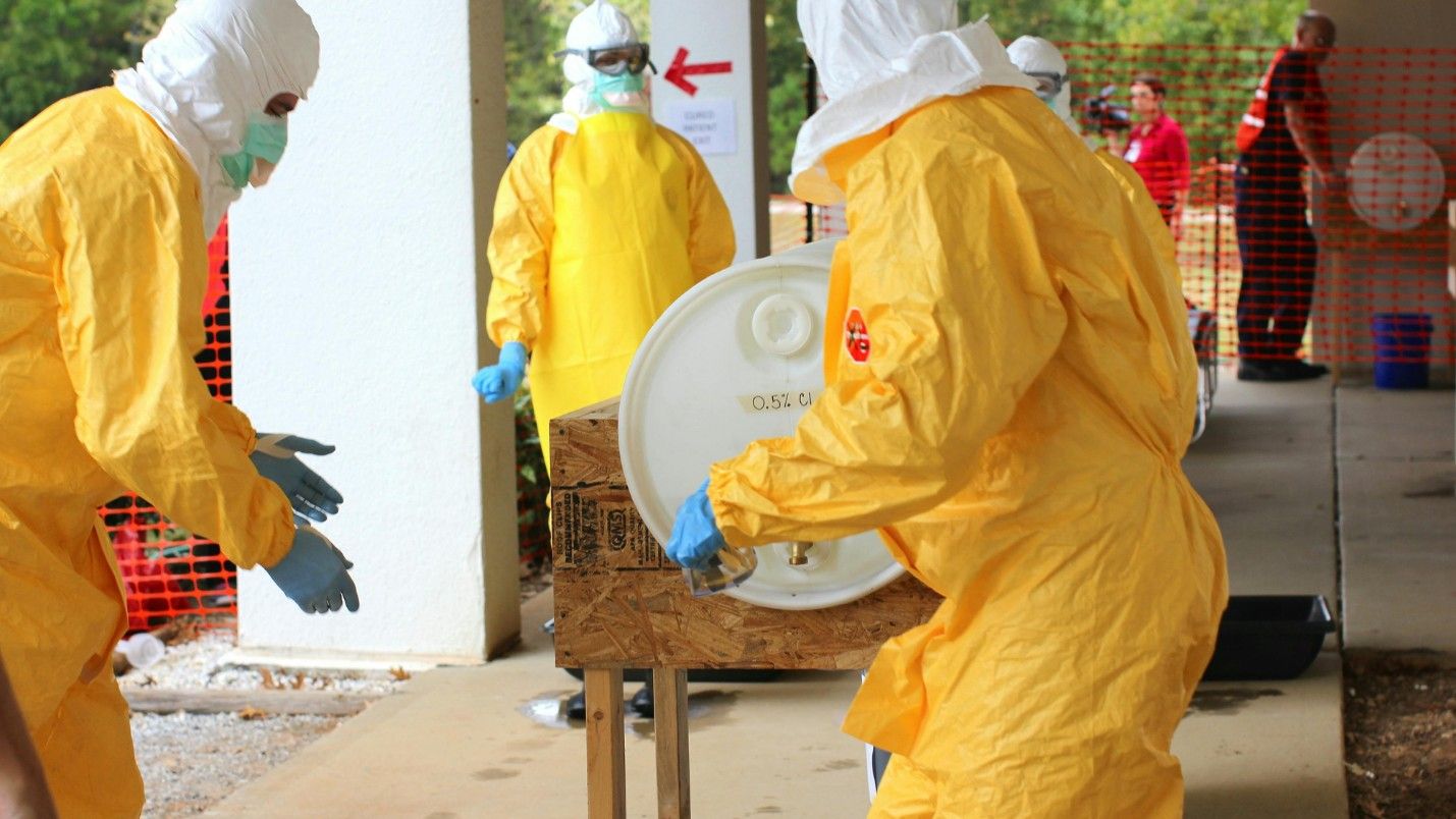 A team of biohazard restoration professionals clean up a toxic chemical site.