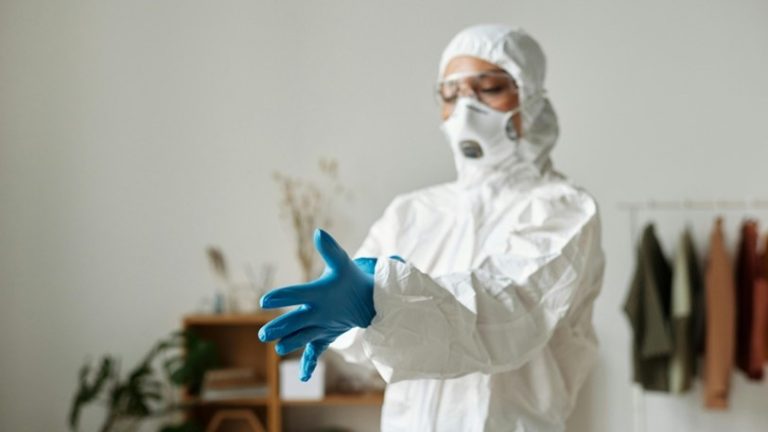 A biohazard restoration expert suits up to clean a business.